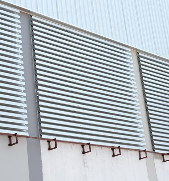 Commercial Wall with Metal Awnings — Budget Screens & Awnings in Lismore, NSW